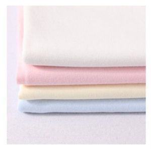 Interlock en blanco y colores. por mayor y por menor